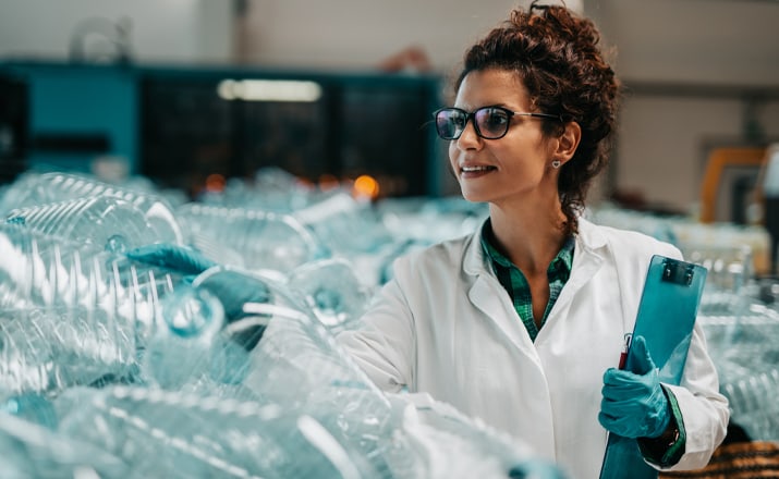 woman checking products in a factory